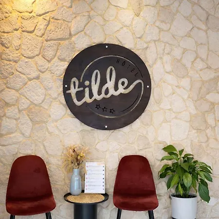Tilde