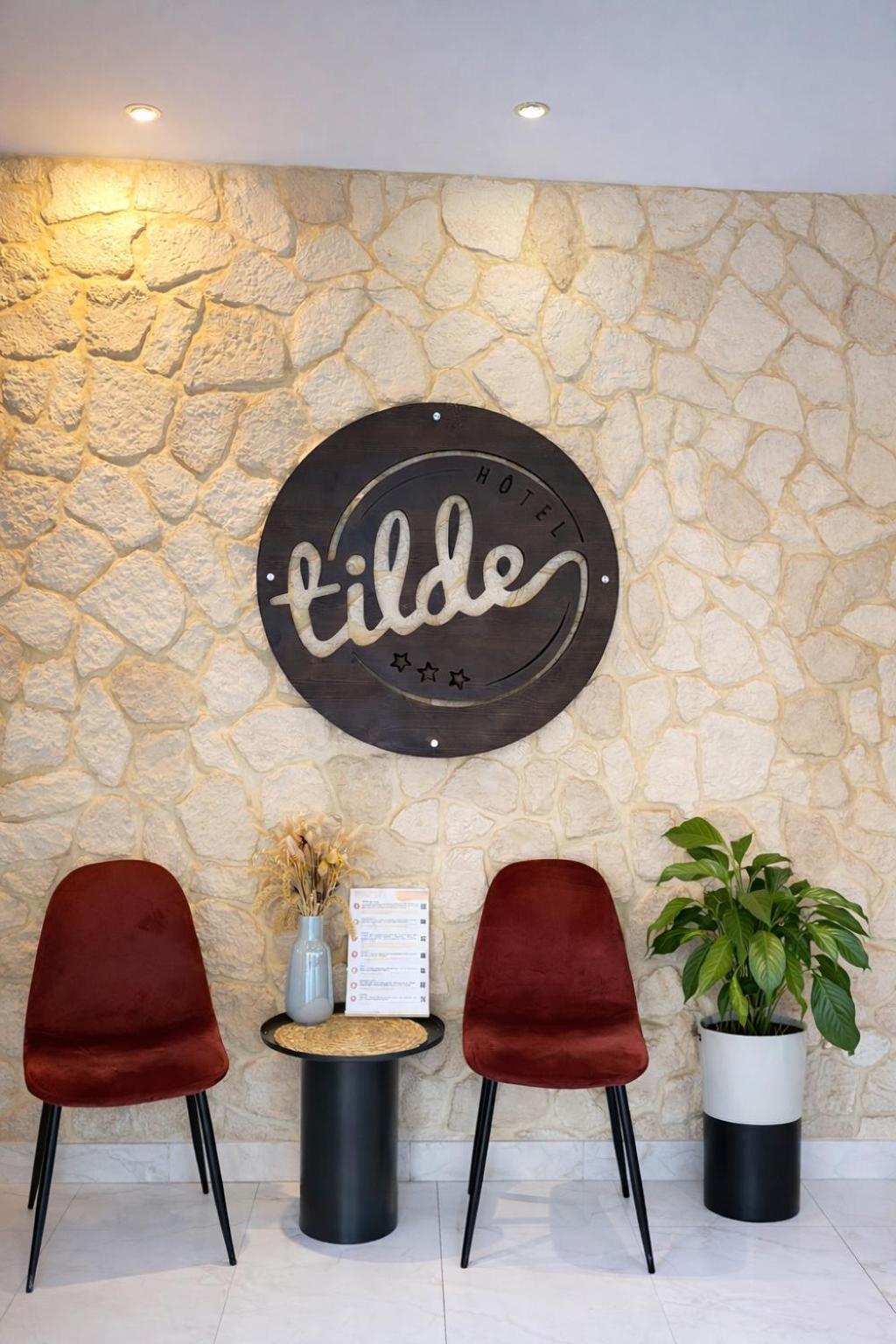 Tilde